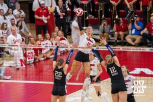 Nebraska Cornhusker Andi Jackson (#15) hits the ball during a college volleyball match against Washington on Friday, October 10, 2025, in Lincoln, Nebraska. Photo by Brandon Tiedemann.