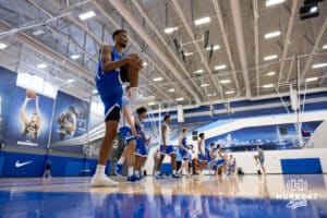 Creighton Bluejay Josh Townley-Thomas (53) stretching his leg, warming up during media day on Thursday, October 9, 2025, in Omaha, Nebraska. Photo by John S. Peterson.