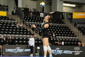 Team Thompson Elise Goetzinger (#13) serves the ball during the Athletes Unlimited Volleyball match against Team Hoffman on Thursday, October 9, 2025, in Omaha, Nebraska. Photo by Brandon Tiedemann.