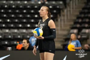 Team Thompson Elise Goetzinger (#13) waits to serve during the Athletes Unlimited Volleyball match against Team Hoffman on Thursday, October 9, 2025, in Omaha, Nebraska. Photo by Brandon Tiedemann.