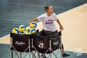 Team Hoffman head coach Kayla Banwarth lobs balls before the Athletes Unlimited Volleyball match against Team Thompson on Thursday, October 9, 2025, in Omaha, Nebraska. Photo by Brandon Tiedemann.
