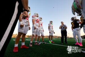 Millard South and Papillion-LaVista players watch the coin toss during a high school football game on Friday, October 3, 2025, in Millard, Nebraska. Photo by Braden Cochran.
