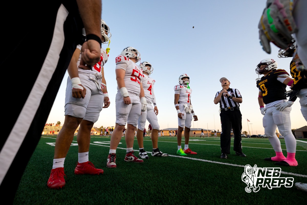 Millard South and Papillion-LaVista players watch the coin toss during a high school football game on Friday, October 3, 2025, in Millard, Nebraska. Photo by Braden Cochran.