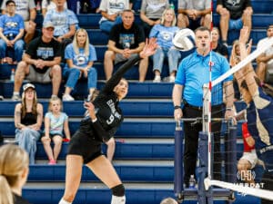 Elkhorn North's Reagan Wallraff (9) spiking the ball over the net during a high school volleyball game @ Elkhorn South on Tuesday, September 30, 2025, in Omaha, Nebraska. Photo By Jack Stephens.
