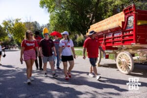 Nebraska Cornhusker fans walking to the stadium for the Nebraska vs Michigan State football game on Saturday, October 4, 2025, in Lincoln, Nebraska. Photo by John S. Peterson.