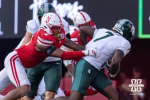 Nebraska Cornhusker defensive back Malcolm Hartzog Jr. (7) tackles Michigan State Spartan running back Brandon Tullis (7) in the third quarter during a college football game on Saturday, October 4, 2025, in Lincoln, Nebraska. Photo by John S. Peterson.