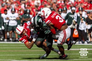 Nebraska Cornhusker defensive back Donovan Jones (37) and defensive back Marques Buford Jr. (3) tackle Michigan State Spartan wide receiver Nick Marsh (6) in the first quarter during a college football game on Saturday, October 4, 2025, in Lincoln, Nebraska. Photo by John S. Peterson.