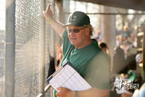 A Lincoln Southwest coach talks to the 3rd base coach with something he's nnoticed during a High School Volleyball game, Thursday, October 2nd, 2025, Lincoln, Nebraska. Photo by Braden Cochran.