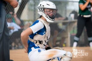A Millard North Catchers looks to her coach for the pitch call during a High School Volleyball game, Thursday, October 2nd, 2025, Lincoln, Nebraska. Photo by Braden Cochran.