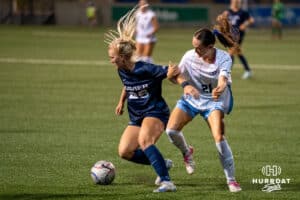 Creighton Bluejay Clara Kulick (#21) fights for the ball during a match against Xavier on Wednesday, October 1st, 2025 in Omaha, Nebraska. Photo by Brandon Tiedemann.