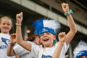 A young fan cheers during a match against Xavier on Wednesday, October 1st, 2025 in Omaha, Nebraska. Photo by Brandon Tiedemann.