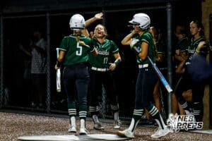 Lincoln Southwest's Brenly Trautman (5) and Brenly Noerrlinger (17) celebrate after scoring a run during a high school softball game @ Elkhorn South on Monday, September 29, 2025, in Omaha, Nebraska. Photo By Jack Stephens.