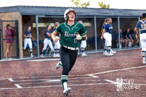 Lincoln Southwest's Brenly Noerrlinger (17) scoring a run during a high school softball game @ Elkhorn South on Monday, September 29, 2025, in Omaha, Nebraska. Photo By Jack Stephens.