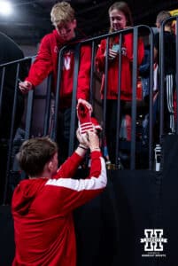 Nebraska Cornhusker guard Connor Essegian signs a shoe for a fan after a college basketball game against the South Carolina Upstate Spartans on Saturday, November 29, 2025, in Lincoln, Nebraska. Photo by John S. Peterson.