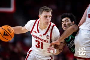 Nebraska Cornhusker guard Cale Jacobsen (31) dribbles the ball against South Carolina Upstate Spartan guard Mason Bendinger (9) in the second half during a college basketball game on Saturday, November 29, 2025, in Lincoln, Nebraska. Photo by John S. Peterson.