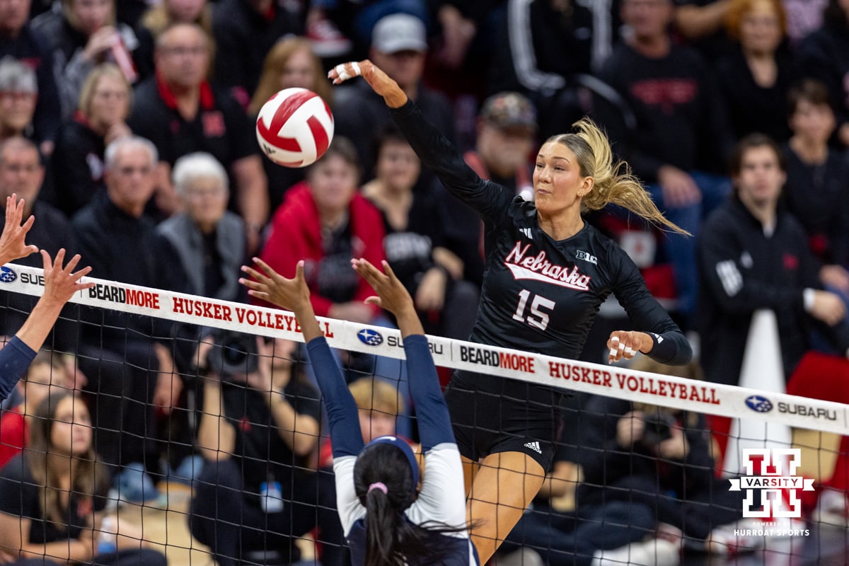 Nebraska Cornhusker middle blocker Andi Jackson (15) spikes the ball against the Penn State Nittany Lions in the third set during a volleyball match on Friday, Nov. 28, 2025, in Lincoln, Nebraska. Photo by John S. Peterson.