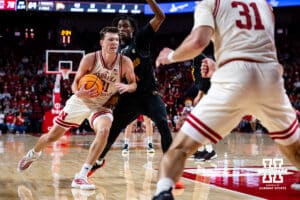 Nebraska Cornhusker forward Pryce Sandfort (21) drives to the basket against Winthrop Eagle forward Pharell Boyogueno (4) in the second half during a college basketball game on Tuesday, Nov. 25, 2025, in Lincoln, Nebraska. Photo by John S. Peterson.