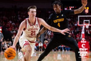 Nebraska Cornhusker forward Pryce Sandfort (21) drives to the basket against Winthrop Eagle forward Pharell Boyogueno (4) in the second half during a college basketball game on Tuesday, Nov. 25, 2025, in Lincoln, Nebraska. Photo by John S. Peterson.