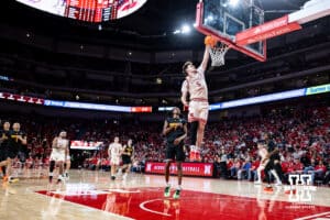 Nebraska Cornhusker forward Braden Frager (5) makes a dunk against Winthrop Eagle guard Daylen Berry (7) in the second half during a college basketball game on Tuesday, Nov. 25, 2025, in Lincoln, Nebraska. Photo by John S. Peterson.