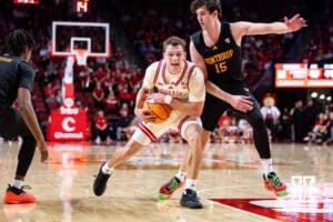 Nebraska Cornhusker guard Cale Jacobsen (31) drive to the basket against Winthrop Eagle forward Tommy Kamarad (15) in the second half during a college basketball game on Tuesday, Nov. 25, 2025, in Lincoln, Nebraska. Photo by John S. Peterson.