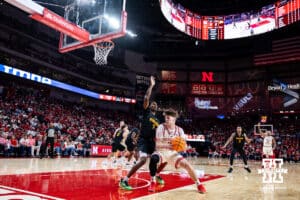 Nebraska Cornhusker forward Braden Frager (5) drives to the basket against Winthrop Eagle guard Daylen Berry (7) in the first half during a college basketball game on Tuesday, Nov. 25, 2025, in Lincoln, Nebraska. Photo by John S. Peterson.