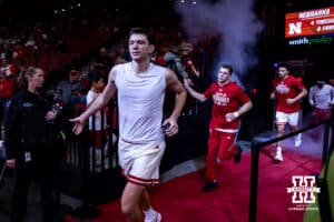 Nebraska Cornhusker forward Pryce Sandfort (21) leads the Huskers out for warm-ups against the Winthrop Eagles during a college basketball game on Tuesday, Nov. 25, 2025, in Lincoln, Nebraska. Photo by John S. Peterson.