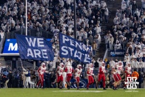 Penn State Nittany Lions cheer squad runs the Penn State flags after a touchdown against the Nebraska Cornhuskers during a college football game on Saturday, Nov. 22, 2025, in State College, PA. Photo by John S. Peterson.