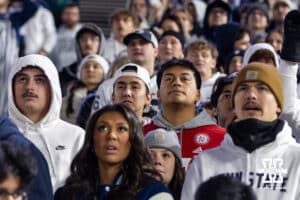 Lone Nebraska Cornhusker fan in the middle of a bunch of Penn State Nittany Lions fans during a college football game on Saturday, Nov. 22, 2025, in State College, PA. Photo by John S. Peterson.