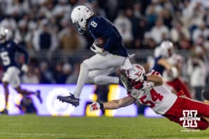 Penn State Nittany Lion wide receiver Trebor Pena (8) jump as he runs with ball against Nebraska Cornhusker linebacker Jacob Bower (54) during a college football game on Saturday, Nov. 22, 2025, in State College, PA. Photo by John S. Peterson.