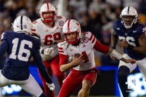 Nebraska Cornhusker quarterback TJ Lateef (14) runs with the ball against Penn State Nittany Lion safety King Mack (16) during a college football game on Saturday, Nov. 22, 2025, in State College, PA. Photo by John S. Peterson.
