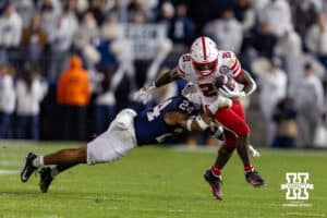 Nebraska Cornhusker running back Emmett Johnson (21) runs with the ball against Penn State Nittany Lion linebacker Amare Campbell (24)in the first quarter during a college football game on Saturday, Nov. 22, 2025, in State College, PA. Photo by John S. Peterson.