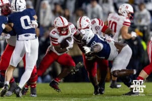 Nebraska Cornhusker running back Emmett Johnson (21) slides through a hole in the line in the first quarter against the Penn State Nittany Lions during a college football game on Saturday, Nov. 22, 2025, in State College, PA. Photo by John S. Peterson.