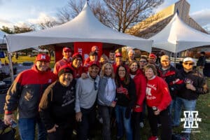 Nebraska Cornhusker fans pose for a group photo while tailgating before the game against Penn State during a college football game on Saturday, Nov. 22, 2025, in State College, PA. Photo by John S. Peterson.
