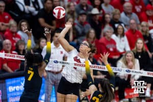 Nebraska Cornhusker middle blocker Rebekah Allick (5) spikes the ball against the Iowa Hawkeyes in the second set during a college volleyball match on Thursday, Nov. 20, 2025, in Lincoln, Nebraska. Photo by John S. Peterson.