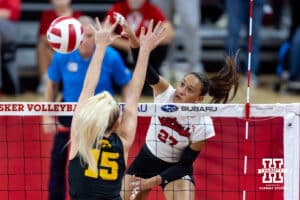 Nebraska Cornhusker outside hitter Harper Murray (27) spikes the ball against Iowa Hawkeye outside hitter Carmel Vares (15) in the second set during a college volleyball match on Thursday, Nov. 20, 2025, in Lincoln, Nebraska. Photo by John S. Peterson.