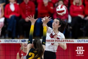 Nebraska Cornhusker opposite Virginia Adriano (9) spikes the ball against Iowa Hawkeye middle hitter Aleksandra Stojanovic (24) in the second set during a college volleyball match on Thursday, Nov. 20, 2025, in Lincoln, Nebraska. Photo by John S. Peterson.