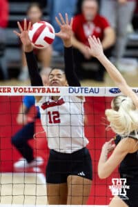 Nebraska Cornhusker outside hitter Taylor Landfair (12) makes a block against the Iowa Hawkeyes in the second set during a college volleyball match on Thursday, Nov. 20, 2025, in Lincoln, Nebraska. Photo by John S. Peterson.