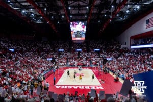 Nebraska Cornhusker fans holding up ace cards after the Huskers scored an ace against the Iowa Hawkeyes in the second set during a college volleyball match on Thursday, Nov. 20, 2025, in Lincoln, Nebraska. Photo by John S. Peterson.
