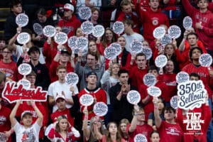 Nebraska Cornhuskers student section holding 350th Sellout signs during a college volleyball match against the Iowa Hawkeyes on Thursday, Nov. 20, 2025, in Lincoln, Nebraska. Photo by John S. Peterson.