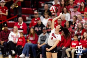 Nebraska Cornhusker opposite Virginia Adriano (9) serves the ball against the Iowa Hawkeyes in the first set during a college volleyball match on Thursday, Nov. 20, 2025, in Lincoln, Nebraska. Photo by John S. Peterson.