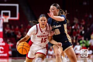 Nebraska Cornhusker guard Kennadi Williams (15) dribbles the ball against Oral Roberts Golden Eagle guard Preslee Hartsock (10) in the fourth quarter during a college basketball game on Wednesday, Nov 19, 2025, in Lincoln, Nebraska. Photo by John S. Peterson.
