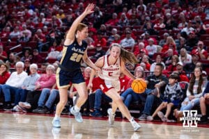 Nebraska Cornhusker guard Claire Johnson (5) dribbles the ball against Oral Roberts Golden Eagle guard Bella Edwards (20) in the fourth quarter during a college basketball game on Wednesday, Nov. 19, 2025, in Lincoln, Nebraska. Photo by John S. Peterson.