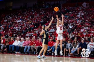Nebraska Cornhusker guard Britt Prince (23) makes a three-point shot against Oral Roberts Golden Eagle guard Jalei Oglesby (11) during a college basketball game on Wednesday, Nov. 19, 2025, in Lincoln, Nebraska. Photo by John S. Peterson.