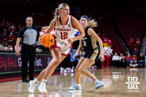 Nebraska Cornhusker forward Jessica Petrie (12) drives to the basket against Oral Roberts Golden Eagle guard Jalei Oglesby (11) in the third quarter during a college basketball game on Wednesday, Nov. 19, 2025, in Lincoln, Nebraska. Photo by John S. Peterson.