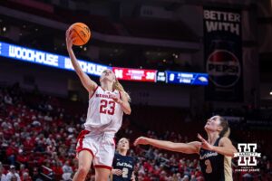 Nebraska Cornhusker guard Britt Prince (23) makes a lay up against Oral Roberts Golden Eagle guard Anna Trusty (3) in the second quarter during a college basketball game on Wednesday, Nov. 19, 2025, in Lincoln, Nebraska. Photo by John S. Peterson.