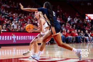 Nebraska Cornhusker guard Britt Prince (23) drives the lane against Oral Roberts Golden Eagle forward A'Maya Holton (22) in the first quarter during a college basketball game on Wednesday, Nov. 19, 2025, in Lincoln, Nebraska. Photo by John S. Peterson.