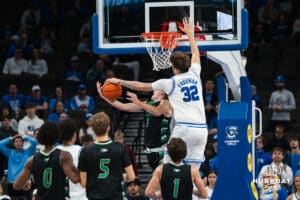 Creighton Bluejay Owen Freeman (32) blocks Greyson Uelmen (3) on a fast break during a basketball game against North Dakota on Wednesday, Nov 19, 2025, in Omaha, Nebraska. Photo by Brandon Tiedemann.