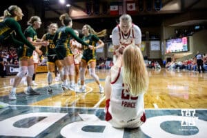 Nebraska Cornhusker forward Petra Bozan (4) helps Britt Prince (23) up after being fouled by North Dakota State Bison during a college basketball game on Sunday, Nov 16, 2025, in Sioux Falls, South Dakota. Photo by John S. Peterson.
