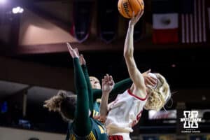 Nebraska Cornhusker guard Britt Prince (23) gets hit in the face when going for a lay up against the North Dakota State Bison during a college basketball game on Sunday, Nov 16, 2025, in Sioux Falls, South Dakota. Photo by John S. Peterson.