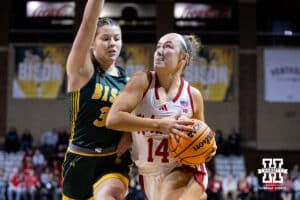 Nebraska Cornhusker guard Callin Hake (14) goes for a lay up against North Dakota State Bison guard Jocelyn Schiller (30) during a college basketball game on Sunday, Nov 16, 2025, in Sioux Falls, South Dakota. Photo by John S. Peterson.